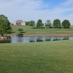 Panoramic view of a lush green golf course at Rosewood Golf & Country Club. Smooth