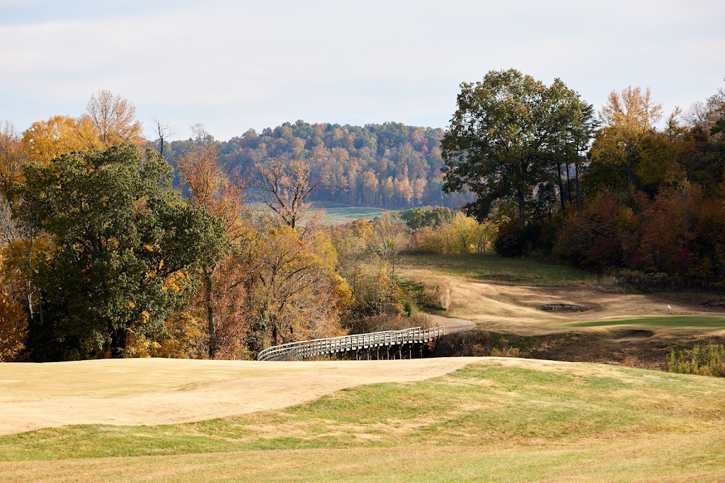 Panoramic view of a lush green golf course at Ross Creek Landing Golf Course. Smooth