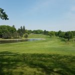 Panoramic view of a lush green golf course at Round Grove Golf & Country Club. Smooth