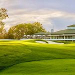 Panoramic view of a lush green golf course at Royal Golf Club. Smooth