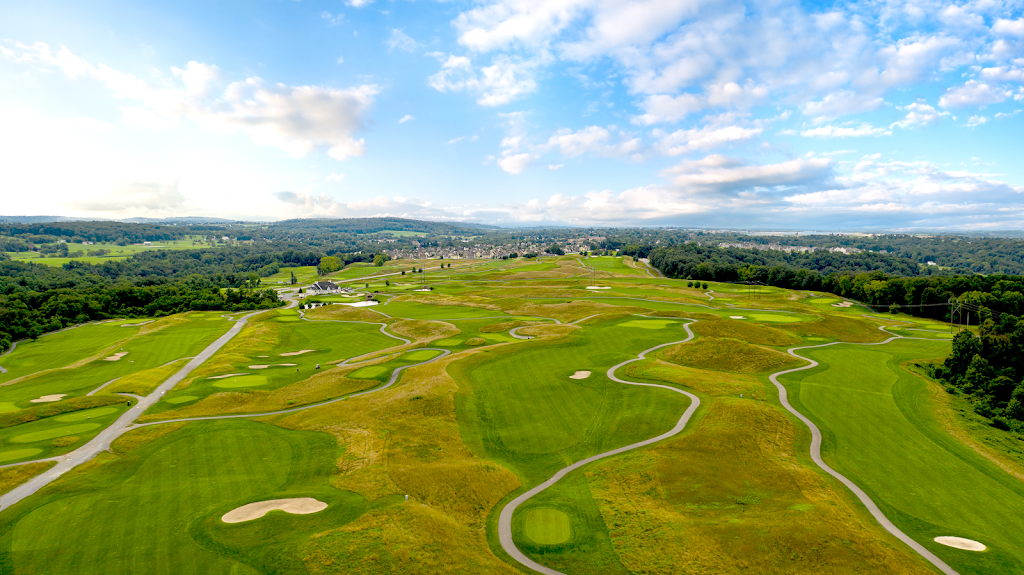 Panoramic view of a lush green golf course at Royal Manchester Golf Links. Smooth