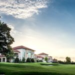 Panoramic view of a lush green golf course at Royal Oaks Country Club. Smooth