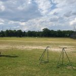 Panoramic view of a lush green golf course at Rum Creek Golf. Smooth