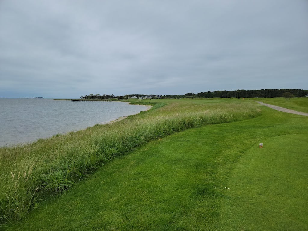 Panoramic view of a lush green golf course at Rum Pointe Seaside Golf Links. Smooth
