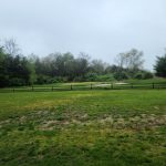 Panoramic view of a lush green golf course at Rutgers Golf Course. Smooth