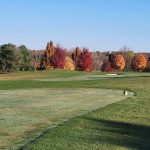 Panoramic view of a lush green golf course at Sable Creek Golf Course. Smooth