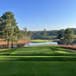 Panoramic view of a lush green golf course at Sage Valley Golf Club. Smooth