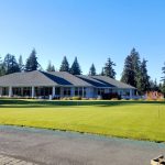 Panoramic view of a lush green golf course at Sahalee Country Club. Smooth