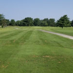 Panoramic view of a lush green golf course at Sahm Golf Course. Smooth