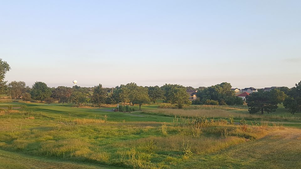 Panoramic view of a lush green golf course at Salina Municipal Golf Course. Smooth