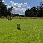green grass with the flag in the hole.