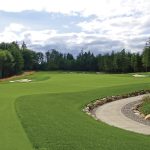 Panoramic view of a lush green golf course at Salish Cliffs Golf Club. Smooth