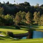 Panoramic view of a lush green golf course at San Dimas Canyon Golf Course. Smooth