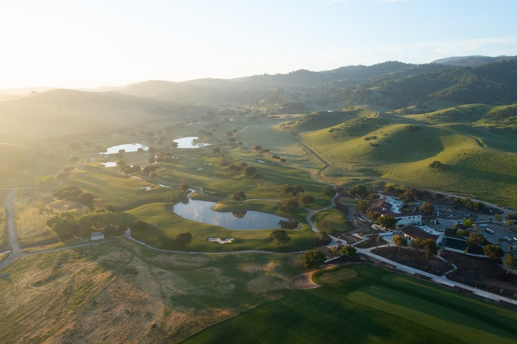 Panoramic view of a lush green golf course at San Juan Oaks Golf Club. Smooth