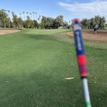 green grass with the flag in the hole.