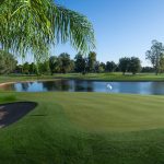 Panoramic view of a lush green golf course at San Marcos Golf Course. Smooth