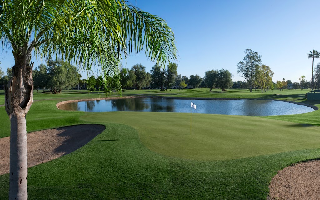 Panoramic view of a lush green golf course at San Marcos Golf Course. Smooth
