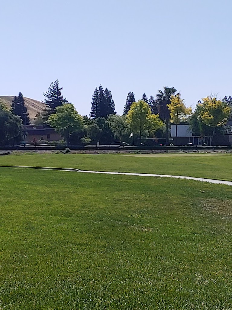 Panoramic view of a lush green golf course at San Ramon Golf Club. Smooth