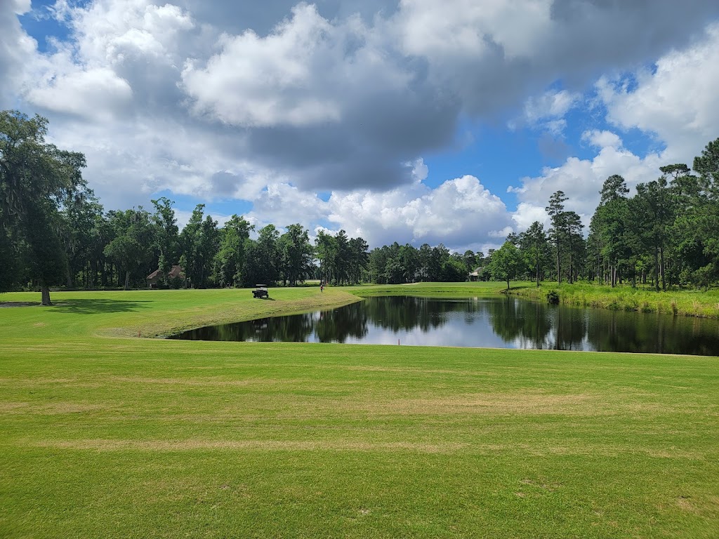 Panoramic view of a lush green golf course at Sanctuary Golf Club. Smooth