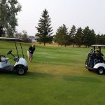 green grass with the flag in the hole.
