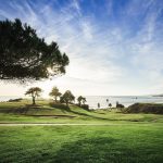 Panoramic view of a lush green golf course at Sandpiper Golf Club. Smooth