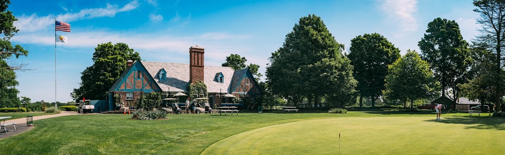 Panoramic view of a lush green golf course at Sandy Hollow Golf Course. Smooth