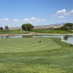 green grass with the flag in the hole.
