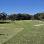 Panoramic view of a lush green golf course at Santa Maria Golf Course. Smooth