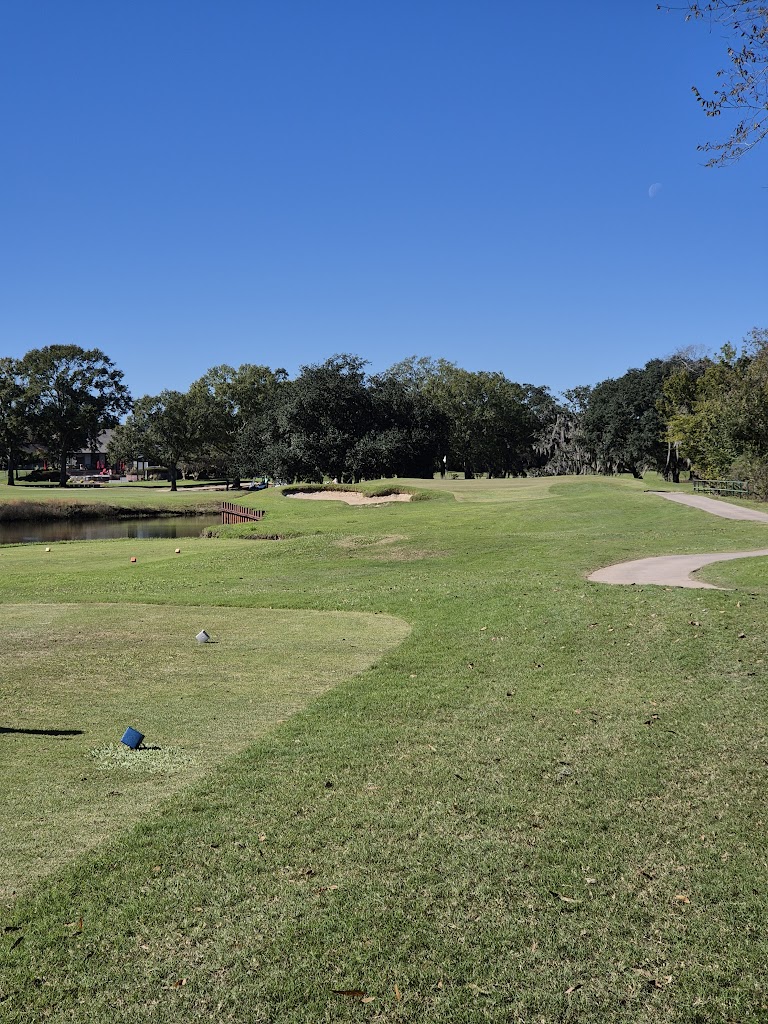 Panoramic view of a lush green golf course at Santa Maria Golf Course. Smooth