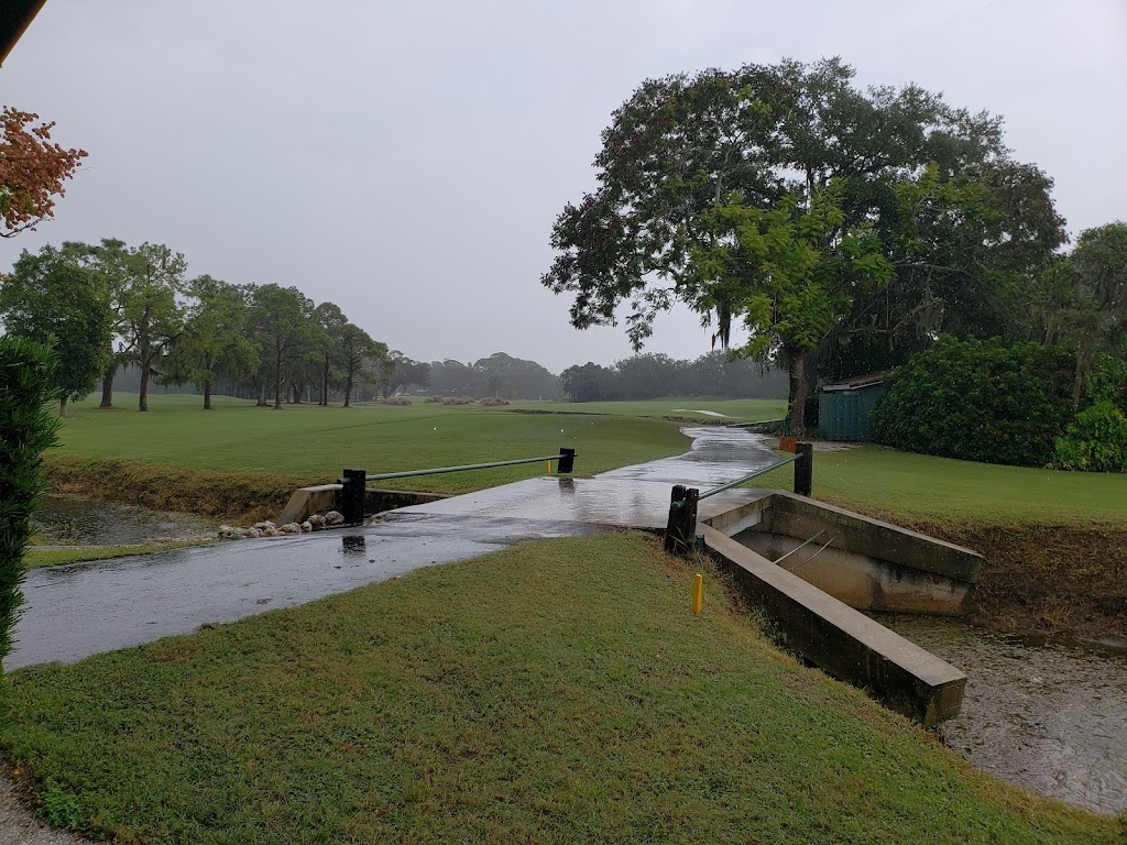 Panoramic view of a lush green golf course at Sara Bay Country Club. Smooth