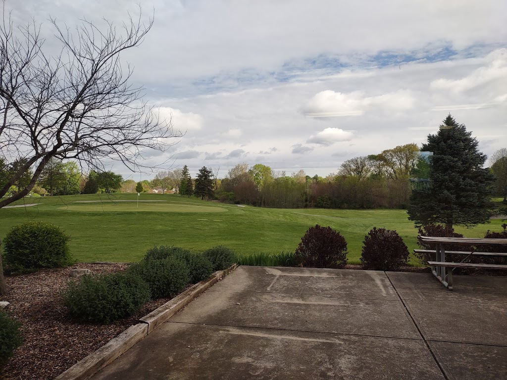 Panoramic view of a lush green golf course at Sarah Shank Golf Course. Smooth