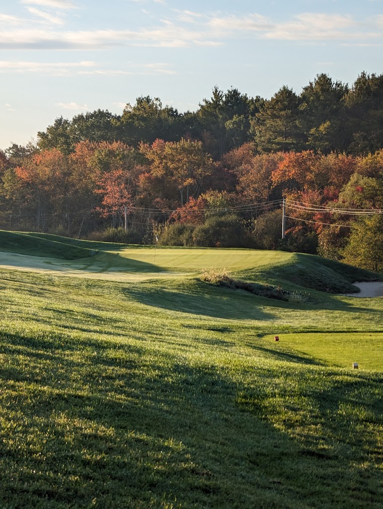 Panoramic view of a lush green golf course at Sassamon Trace Golf Course. Smooth