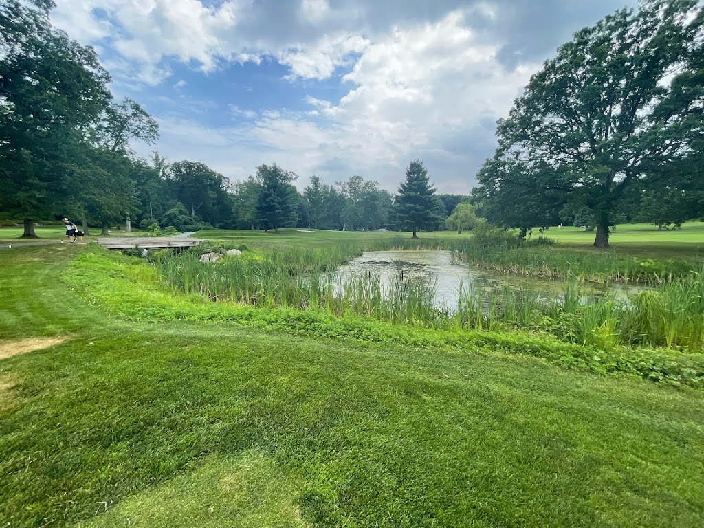 Panoramic view of a lush green golf course at Saxon Woods Golf Course. Smooth