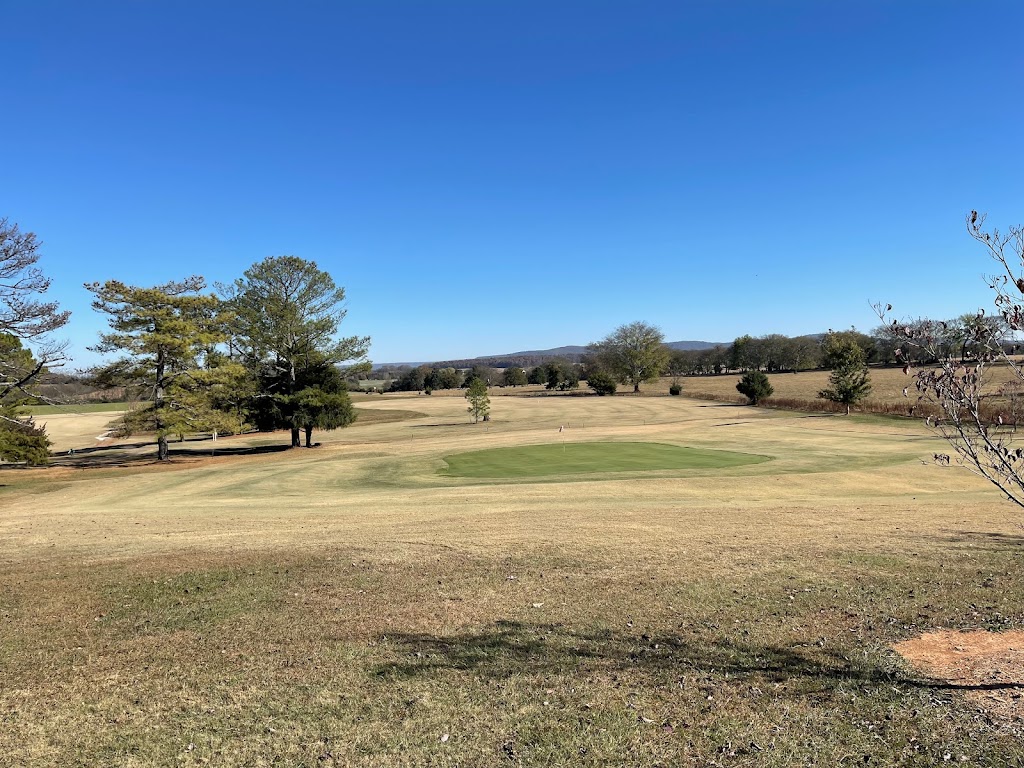 Panoramic view of a lush green golf course at Scenic View Golf Course. Smooth