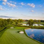 Panoramic view of a lush green golf course at Schaumburg Golf Club. Smooth