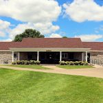Panoramic view of a lush green golf course at Schifferdecker Golf Course. Smooth