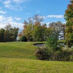 Panoramic view of a lush green golf course at Scotch Hall Golf Shop. Smooth