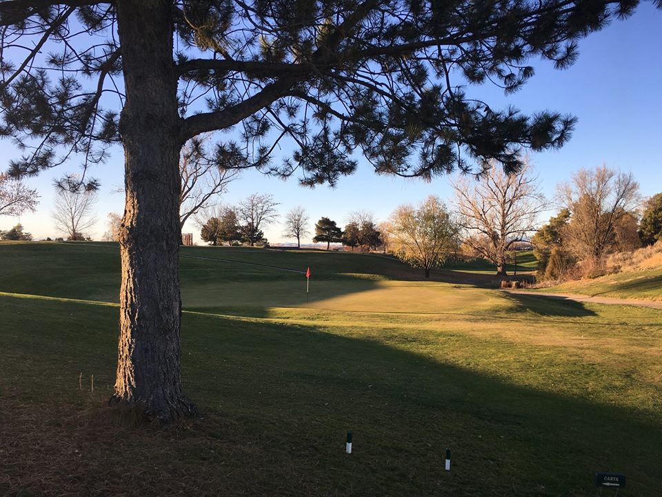 Panoramic view of a lush green golf course at Scotch Pines Golf Course. Smooth