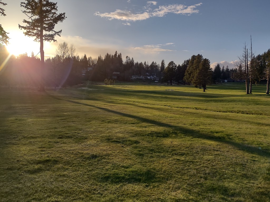 Panoramic view of a lush green golf course at Scott Lake Golf Course. Smooth