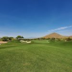 Panoramic view of a lush green golf course at Scottsdale National Golf Club. Smooth