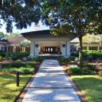 Panoramic view of a lush green golf course at Sea Pines Country Club. Smooth