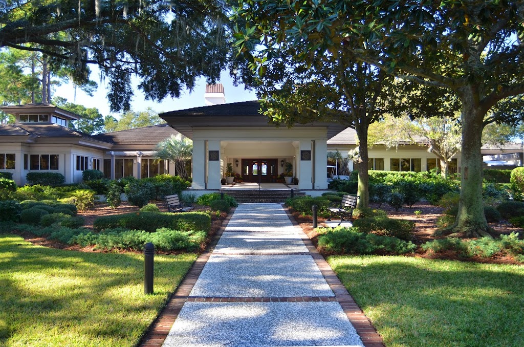Panoramic view of a lush green golf course at Sea Pines Country Club. Smooth