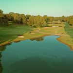 Panoramic view of a lush green golf course at Searcy Country Club. Smooth