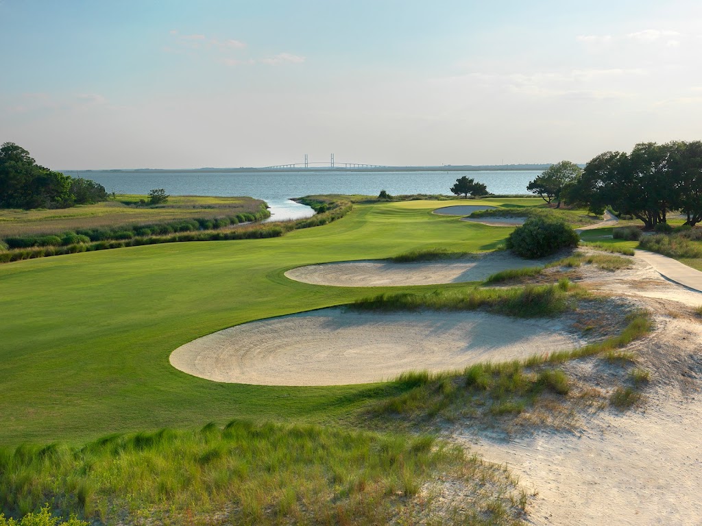 Panoramic view of a lush green golf course at Seaside Golf Course. Smooth