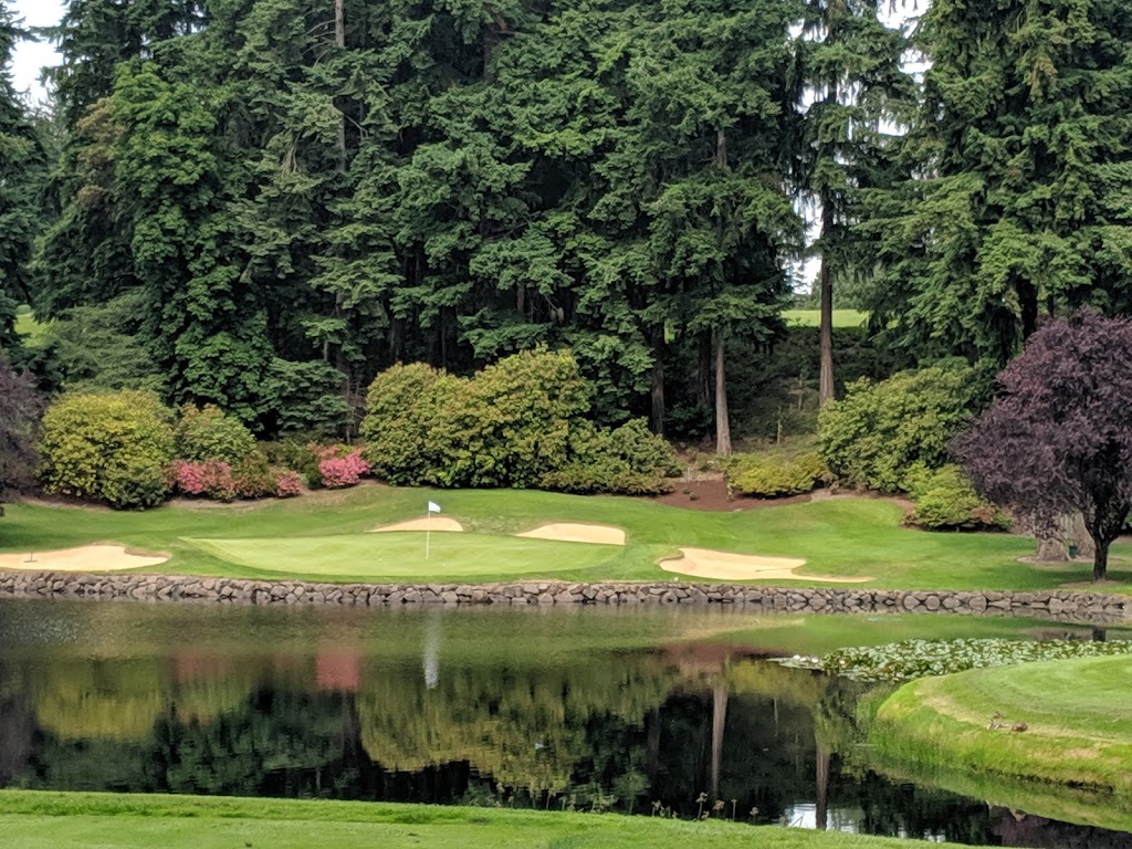 Panoramic view of a lush green golf course at Seattle Golf Club. Smooth