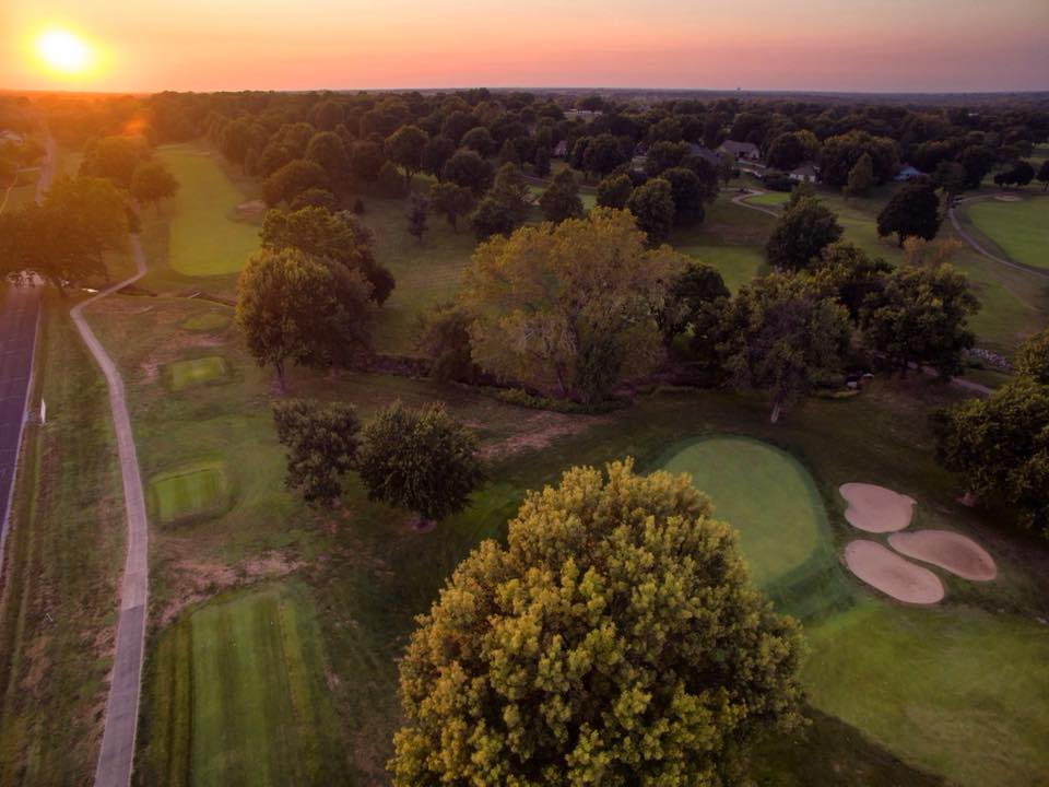Panoramic view of a lush green golf course at Sedalia Country Club. Smooth