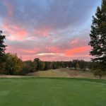 Panoramic view of a lush green golf course at Seneca Golf Course. Smooth