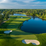 Panoramic view of a lush green golf course at SentryWorld Golf Course. Smooth