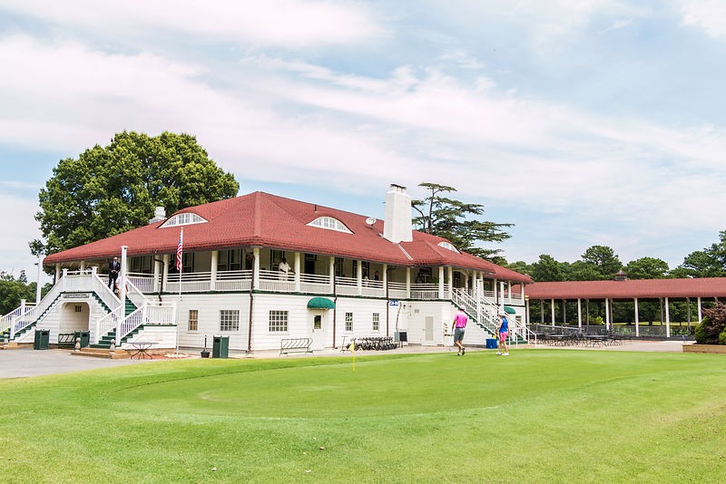 Panoramic view of a lush green golf course at Sewells Point Golf Course. Smooth