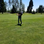 green grass with the flag in the hole.